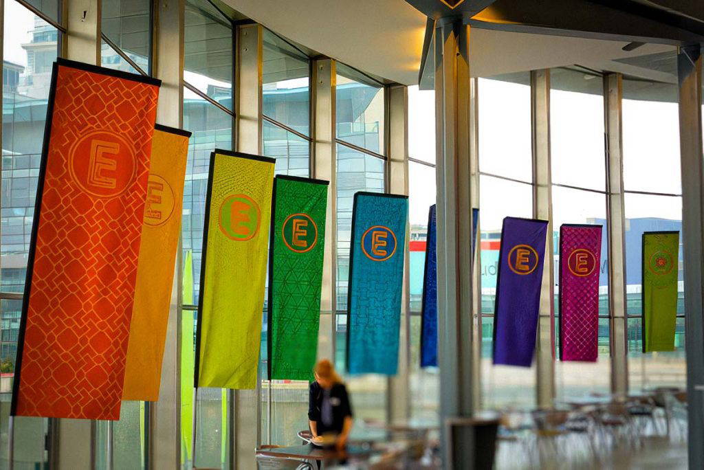 High-visibility outdoor and indoor flags available in Quill, Teardrop, or Straight profiles