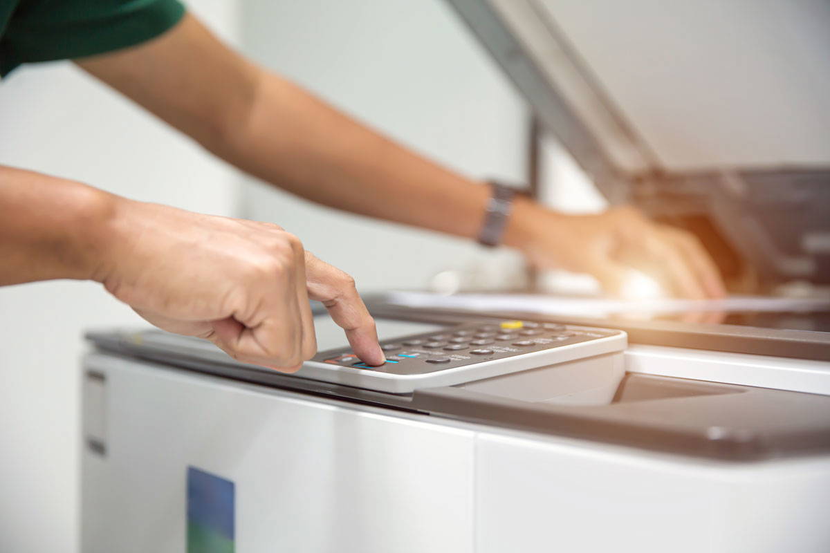 close up of a team member operating a same day printing and photocopying stockport services