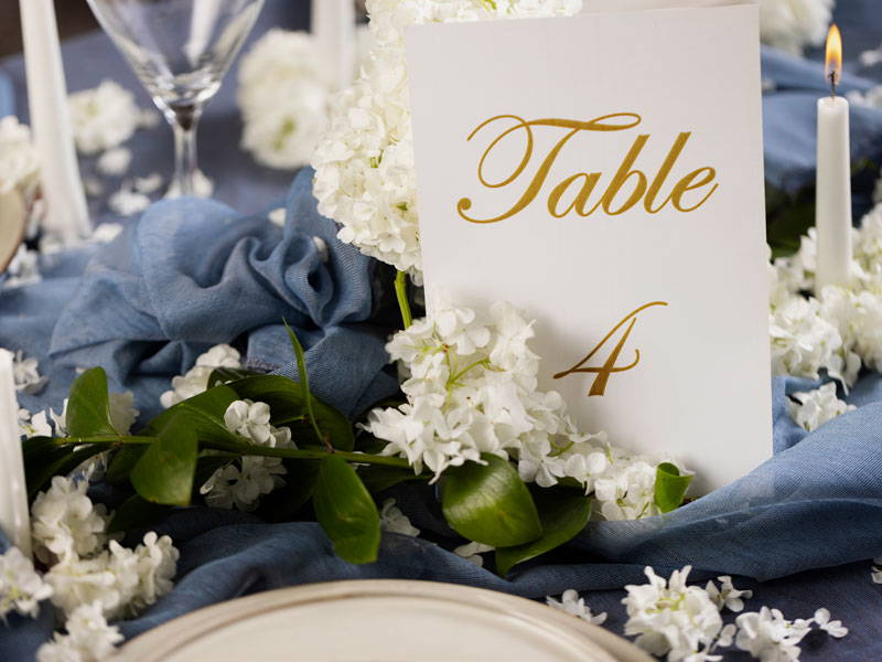 Elegant simple gold foil table numbers and place names card printed with Stockport wedding stationery experts Nettl of stockport offering wedding stationery for every phase of your wedding journey