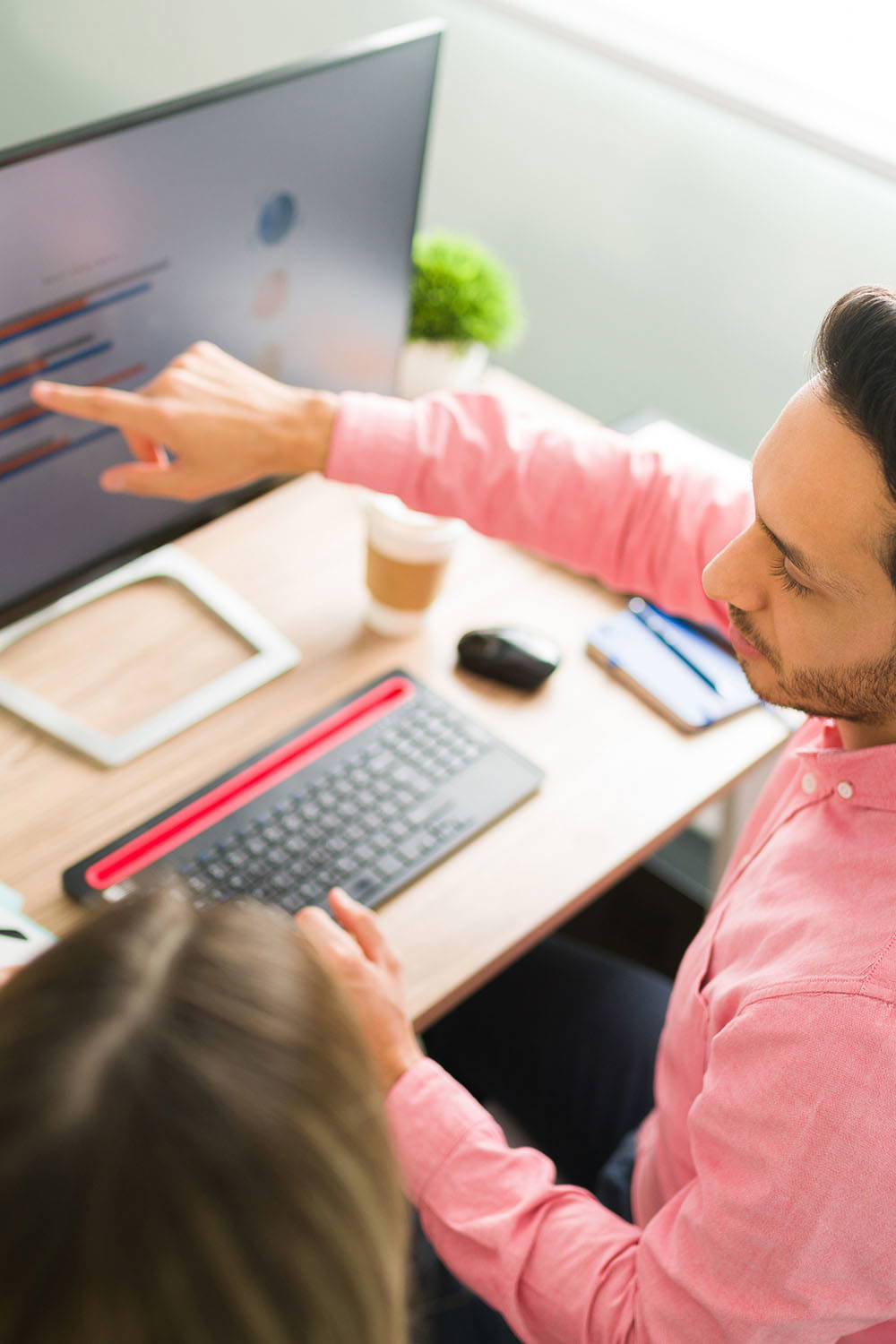 Man and woman having meeting at a desk
